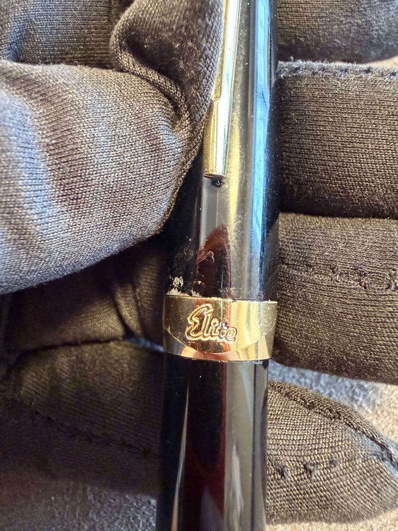 Elite black fountain pen with gold trim and gold finish clip made of metal, elegant design