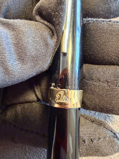 Elite black fountain pen with gold trim and gold finish clip made of metal, elegant design