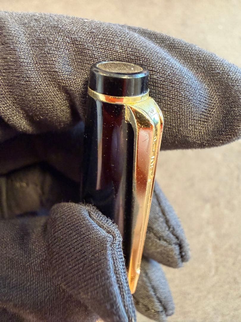 Elite black fountain pen with gold trim and gold finish clip made of metal, elegant design