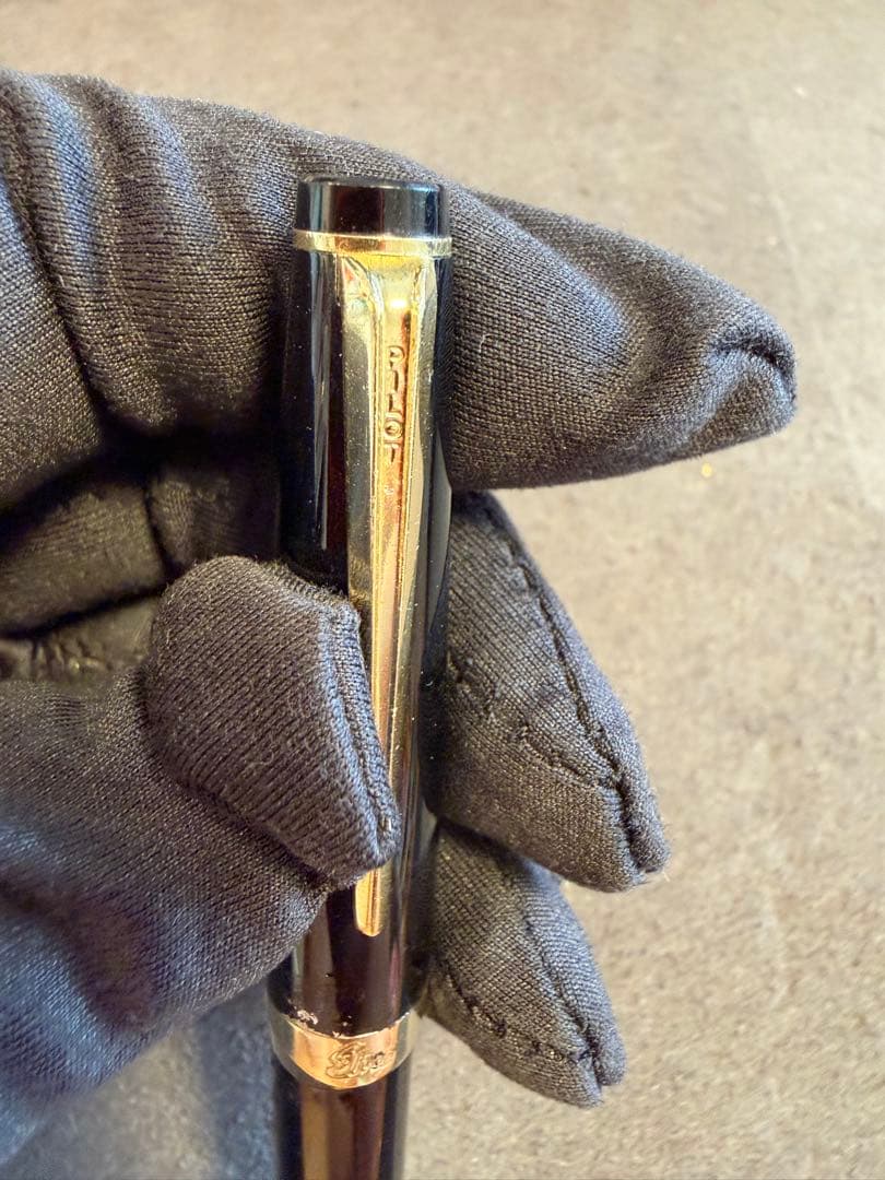 Elite black fountain pen with gold trim and gold finish clip made of metal, elegant design