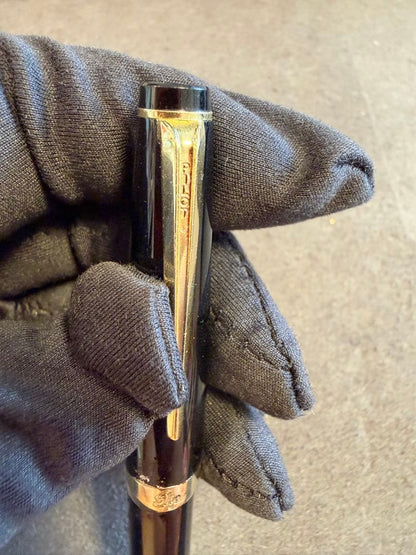Elite black fountain pen with gold trim and gold finish clip made of metal, elegant design