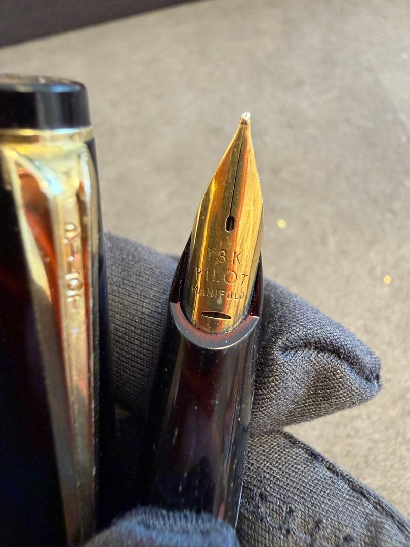 Elite black fountain pen with gold trim and gold finish clip made of metal, elegant design