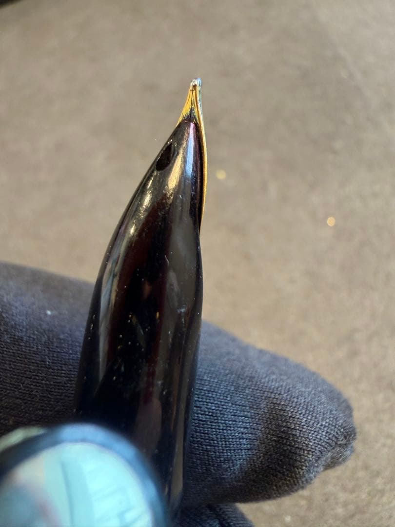 Elite black fountain pen with gold trim and gold finish clip made of metal, elegant design