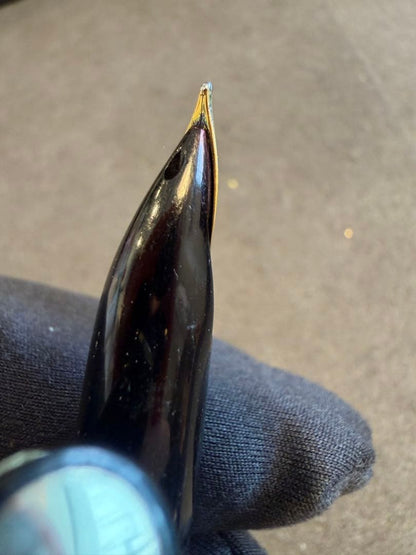 Elite black fountain pen with gold trim and gold finish clip made of metal, elegant design