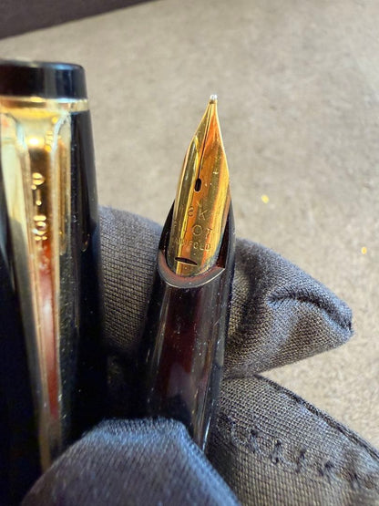 Elite black fountain pen with gold trim and gold finish clip made of metal, elegant design
