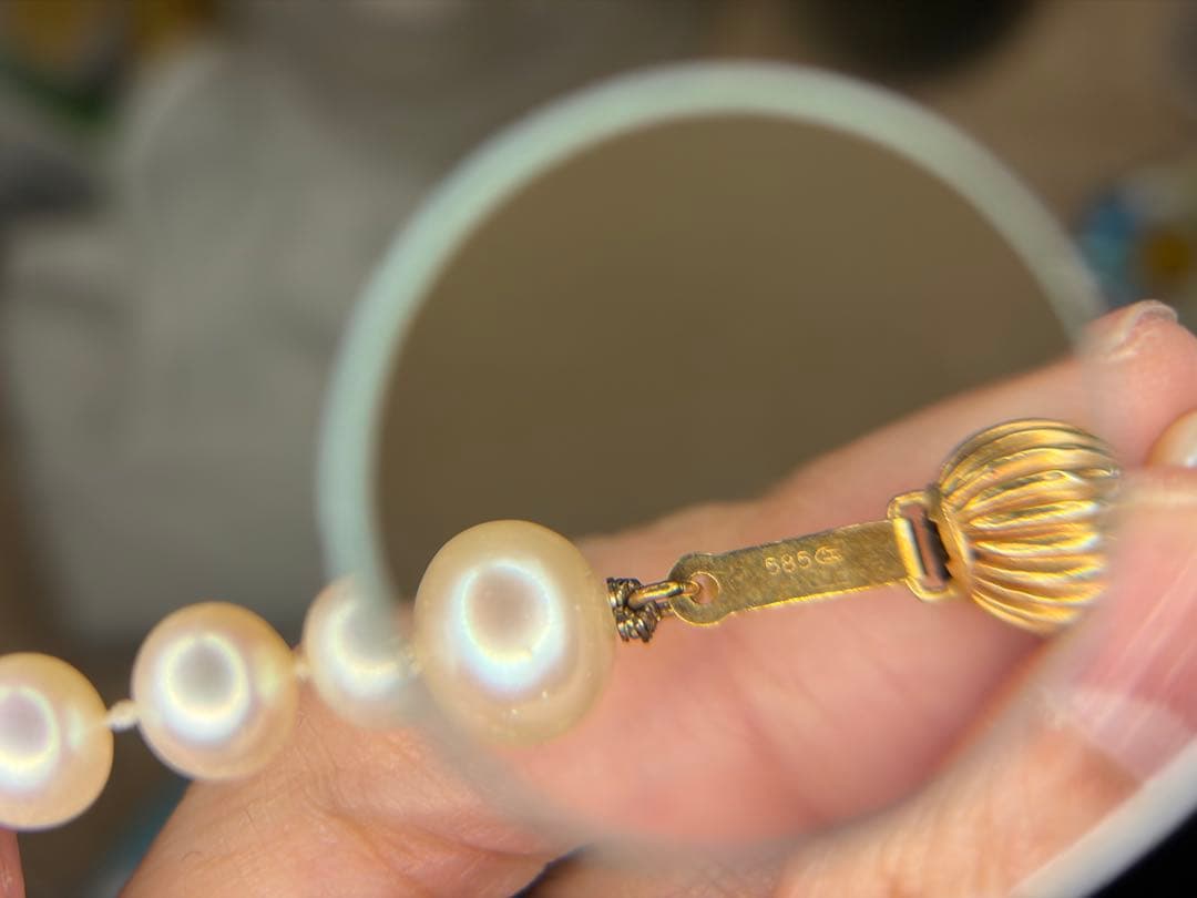 14K gold necklace with oval Akoya pearls showing aurora-like luster and beautiful shine
