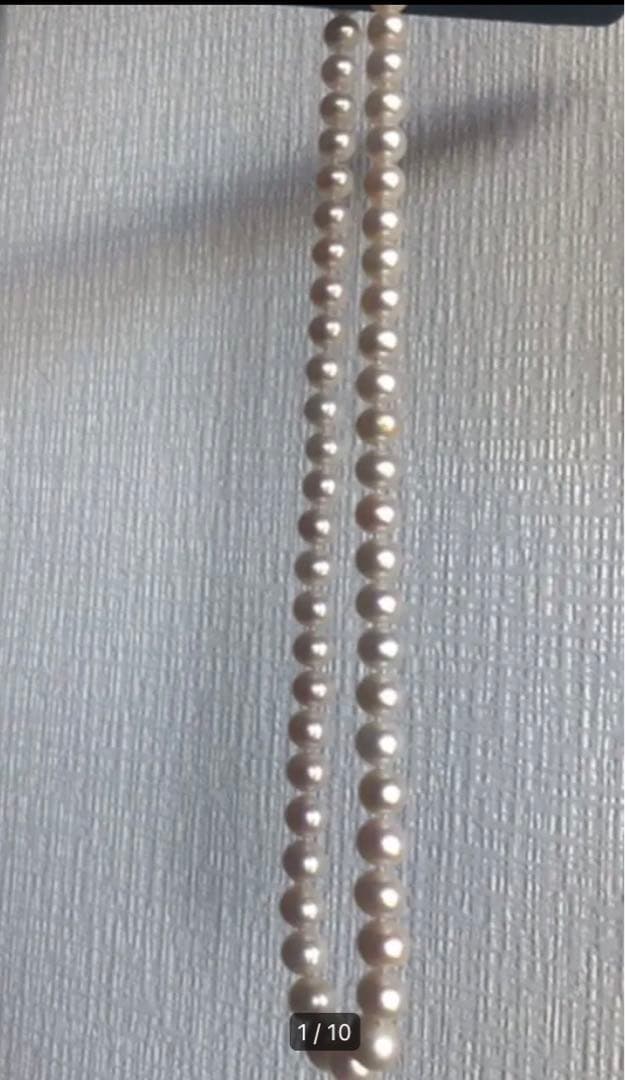 14K gold necklace with oval Akoya pearls showing aurora-like luster and beautiful shine