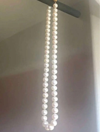 14K gold necklace with oval Akoya pearls showing aurora-like luster and beautiful shine