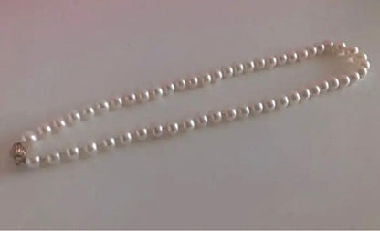14K gold necklace with oval Akoya pearls showing aurora-like luster and beautiful shine
