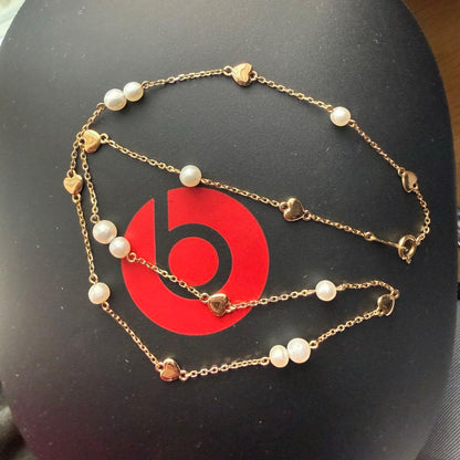 K18YG Heart Motif Pearl Necklace made of 18K gold with a heart design and a single pearl pendant