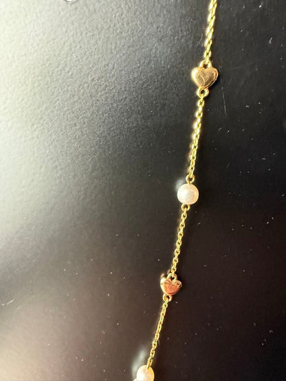 K18YG Heart Motif Pearl Necklace made of 18K gold with a heart design and a single pearl pendant
