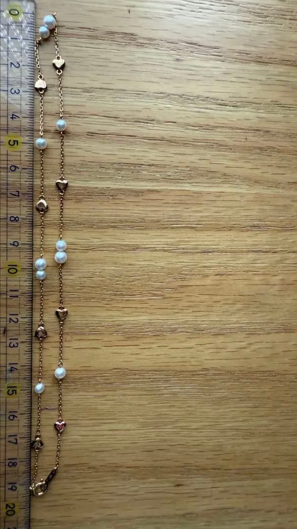 K18YG Heart Motif Pearl Necklace made of 18K gold with a heart design and a single pearl pendant