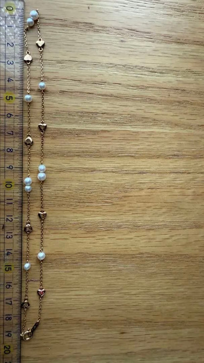 K18YG Heart Motif Pearl Necklace made of 18K gold with a heart design and a single pearl pendant