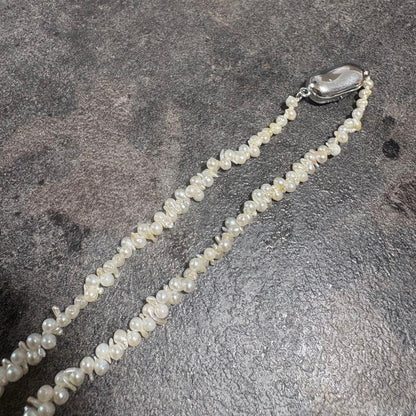 Akoya pearl necklace with silver clasp displayed on white background, 42 cm length