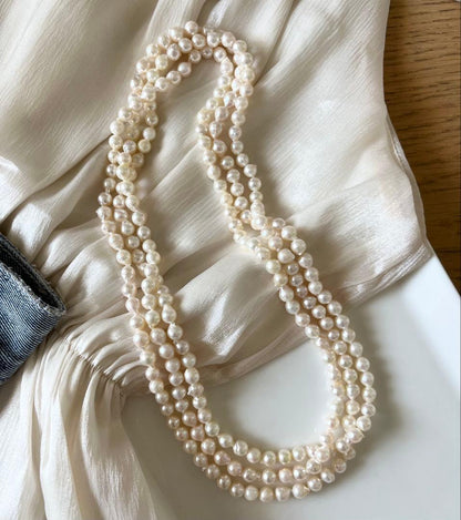 Akoya pearl ultra long necklace with 6.5-7mm off white pearls measuring 162cm in length featuring 2-3 strands
