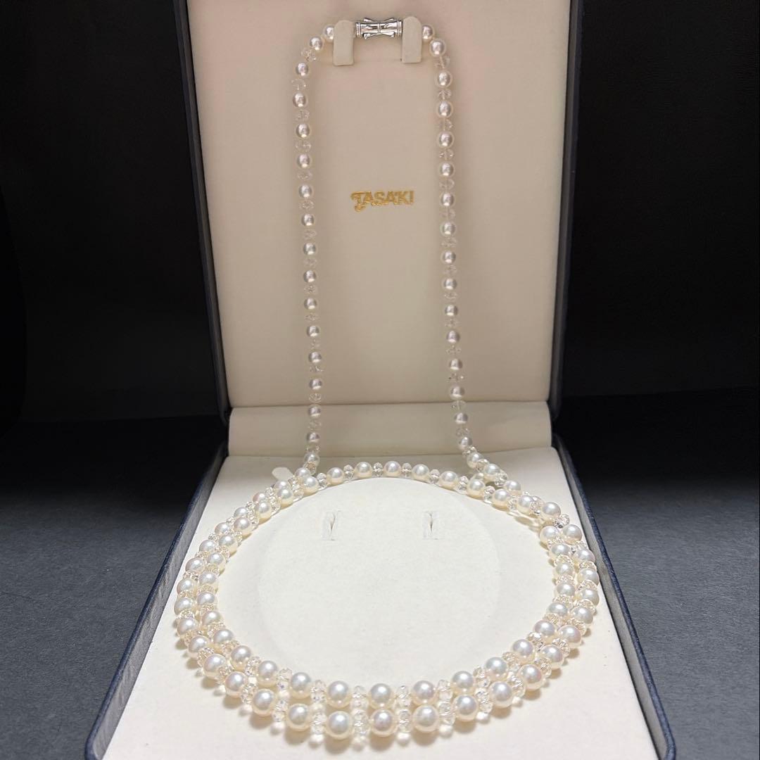 TASAKI Pearls Vari Aoyama 120cm pearl necklace with crystal clasp and silver marking on white background