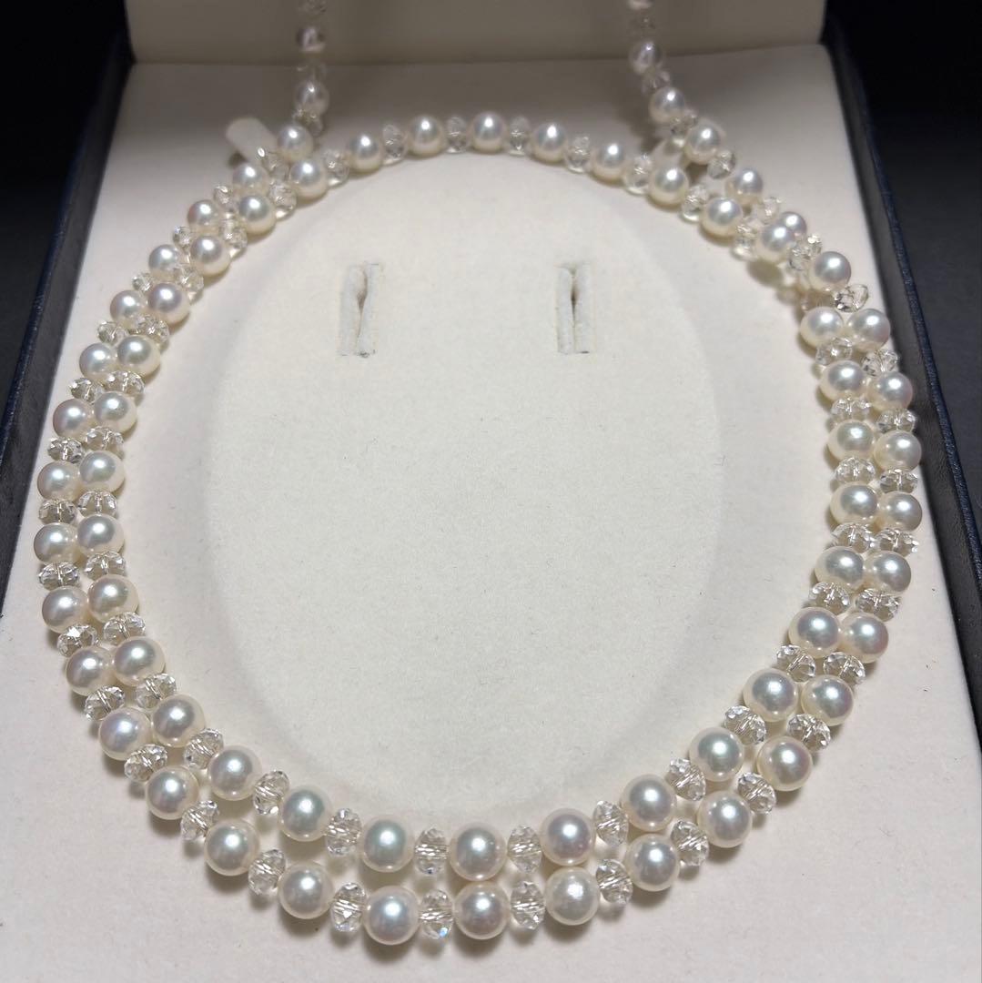 TASAKI Pearls Vari Aoyama 120cm pearl necklace with crystal clasp and silver marking on white background