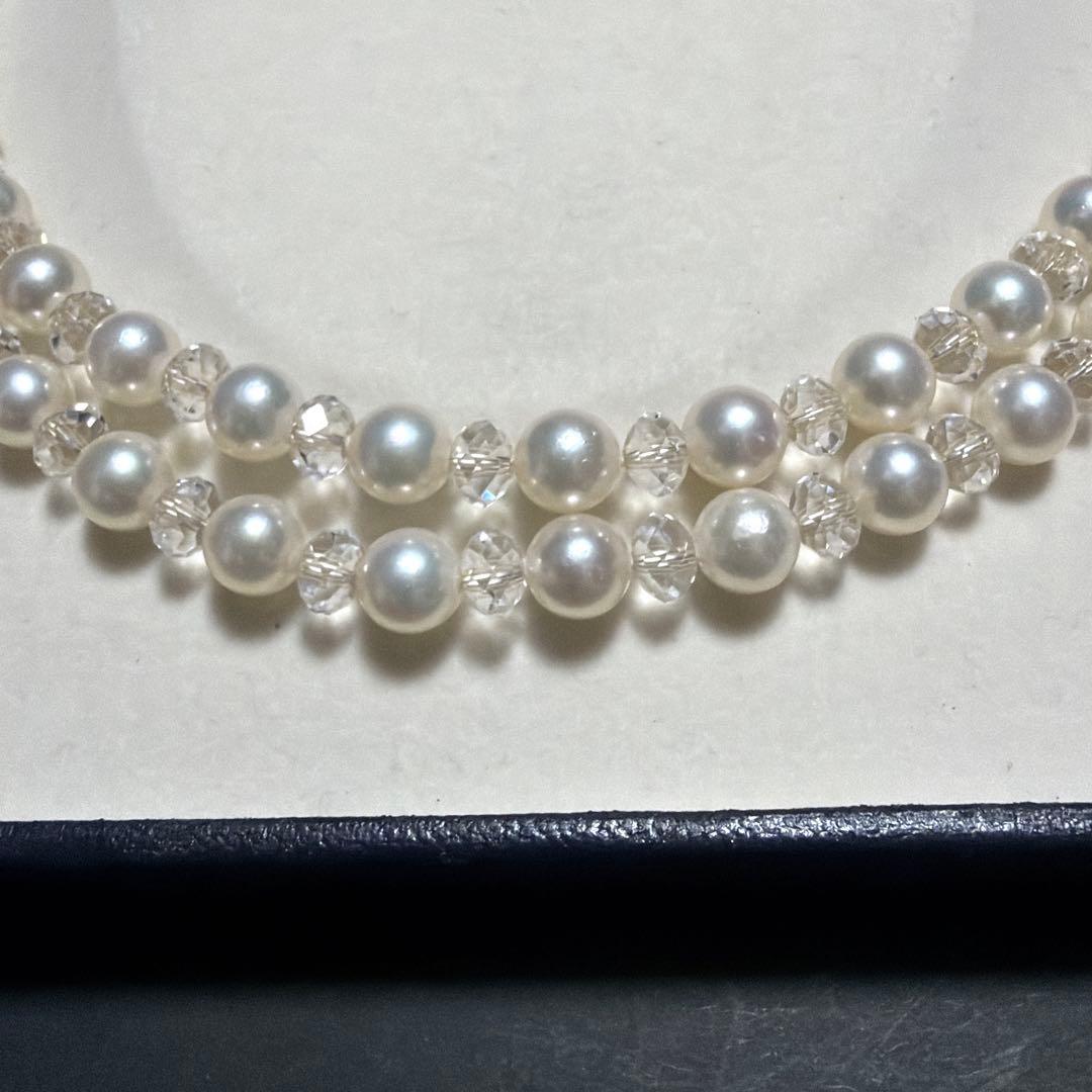 TASAKI Pearls Vari Aoyama 120cm pearl necklace with crystal clasp and silver marking on white background