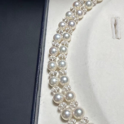 TASAKI Pearls Vari Aoyama 120cm pearl necklace with crystal clasp and silver marking on white background