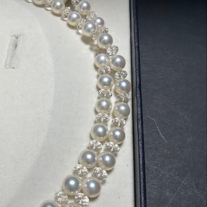 TASAKI Pearls Vari Aoyama 120cm pearl necklace with crystal clasp and silver marking on white background