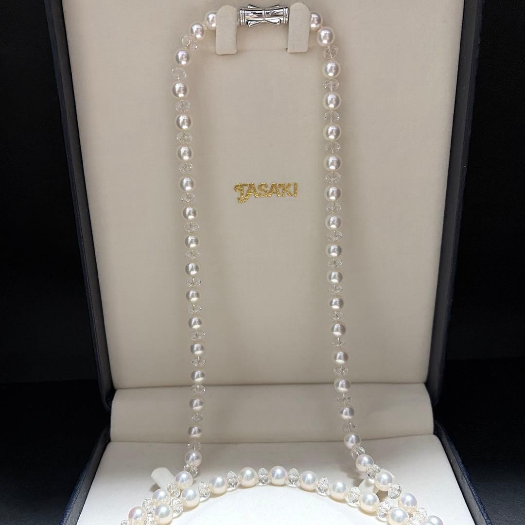 TASAKI Pearls Vari Aoyama 120cm pearl necklace with crystal clasp and silver marking on white background