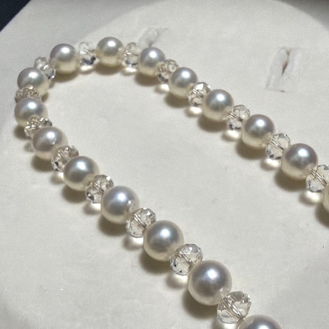 TASAKI Pearls Vari Aoyama 120cm pearl necklace with crystal clasp and silver marking on white background