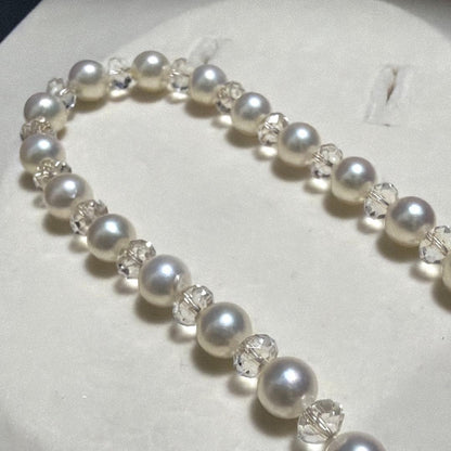 TASAKI Pearls Vari Aoyama 120cm pearl necklace with crystal clasp and silver marking on white background