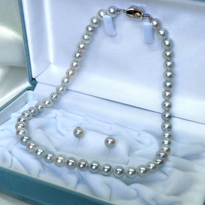 Akoya pearl necklace and earrings set with blue-grey nearly round pearls on silver 925 chain