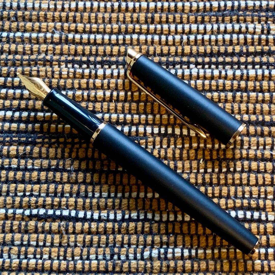 Waterman Hemisphere Matte Black GT fountain pen with gold nib and dedicated case on white background
