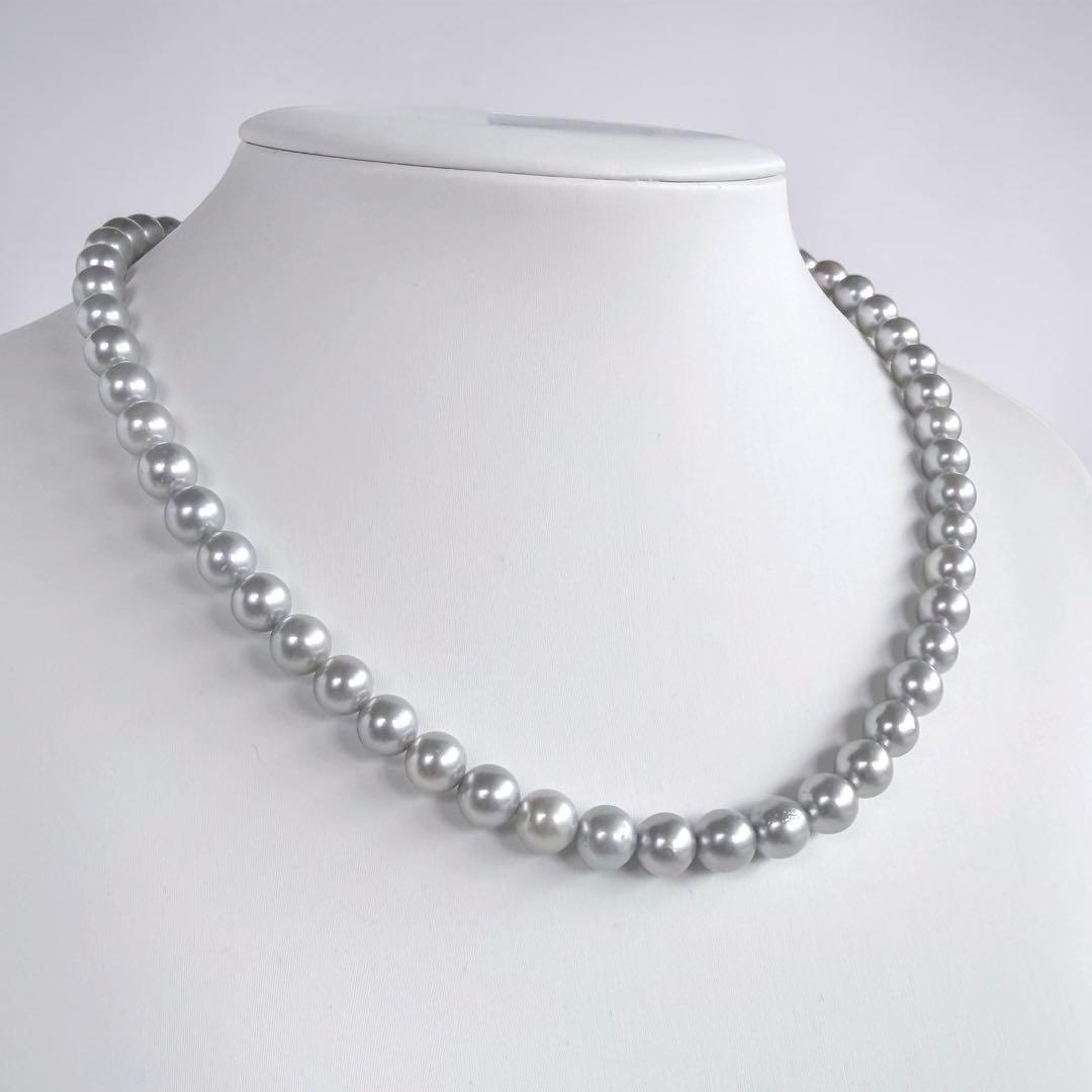 Tasaki Natural Blue Akoya Pearl Necklace 41 cm length with round pearls and silver clasp on white background