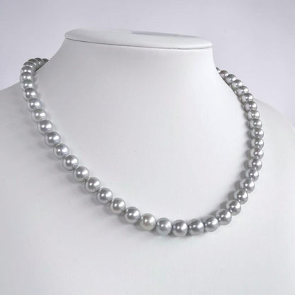 Tasaki Natural Blue Akoya Pearl Necklace 41 cm length with round pearls and silver clasp on white background