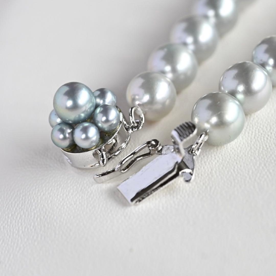 Tasaki Natural Blue Akoya Pearl Necklace 41 cm length with round pearls and silver clasp on white background