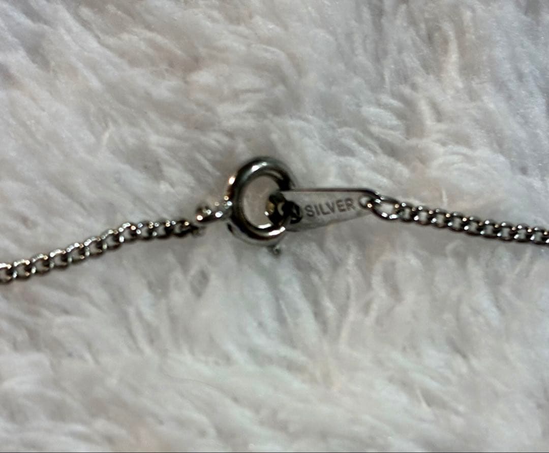 Mikimoto silver pendant necklace with a single pearl, displayed with dedicated jewelry case