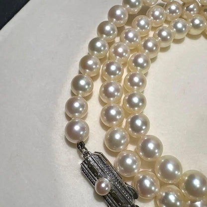 Mikimoto Akoya pearl necklace measuring 56cm with white and cream tone pearls sized 6.4 to 6.9mm