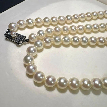 Mikimoto Akoya pearl necklace measuring 56cm with white and cream tone pearls sized 6.4 to 6.9mm
