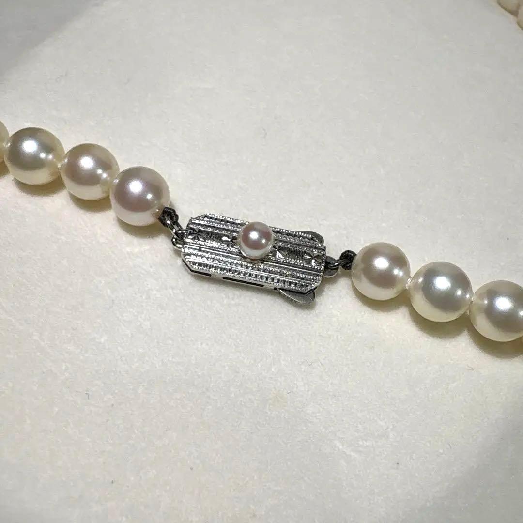 Mikimoto Akoya pearl necklace measuring 56cm with white and cream tone pearls sized 6.4 to 6.9mm