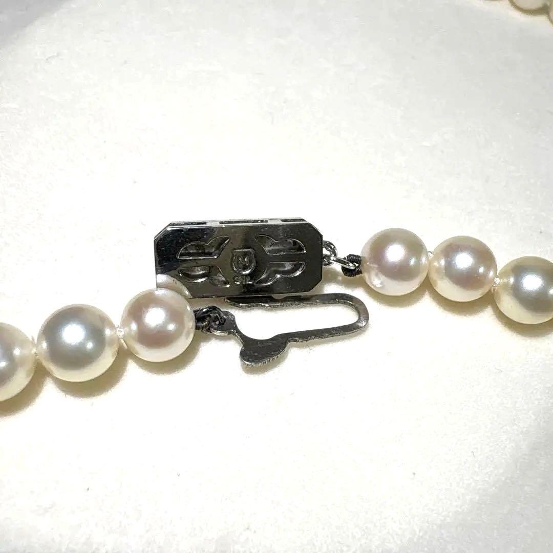 Mikimoto Akoya pearl necklace measuring 56cm with white and cream tone pearls sized 6.4 to 6.9mm