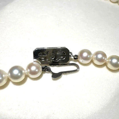 Mikimoto Akoya pearl necklace measuring 56cm with white and cream tone pearls sized 6.4 to 6.9mm