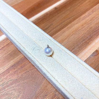 K14 white gold necklace with Tenny Girl grade Akoya pearl showing natural shape and glossy surface