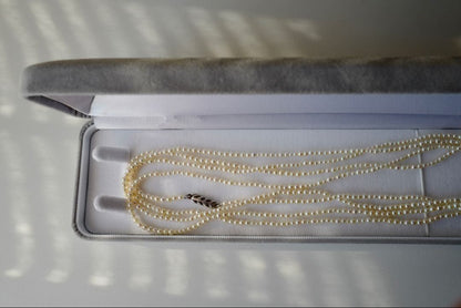 New Akoya pearl necklace with very small 2-3mm ivory pearls on a 64 inch silver chain