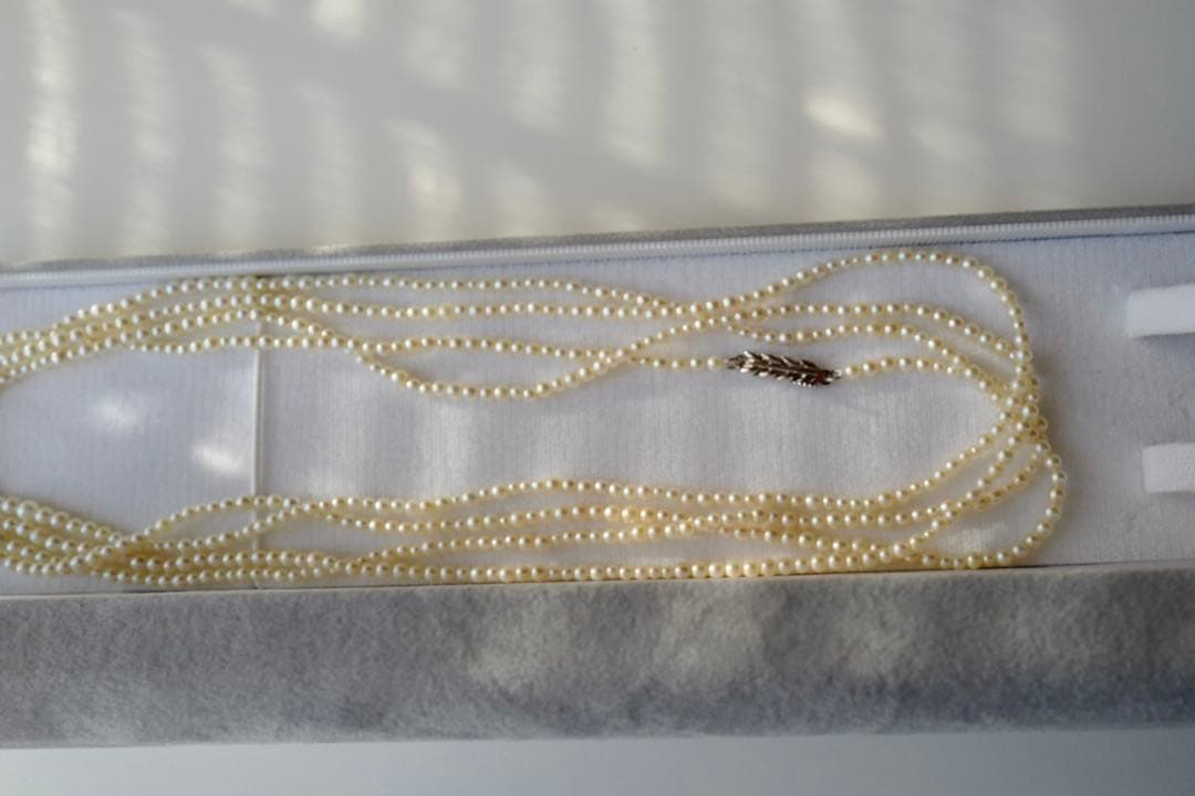 New Akoya pearl necklace with very small 2-3mm ivory pearls on a 64 inch silver chain