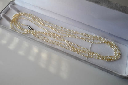 New Akoya pearl necklace with very small 2-3mm ivory pearls on a 64 inch silver chain