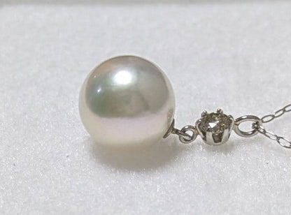 Akoya pearl and diamond pendant necklace featuring 8.3mm round white-green pearl with platinum chain