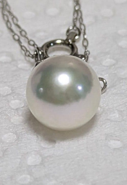 Akoya pearl and diamond pendant necklace featuring 8.3mm round white-green pearl with platinum chain