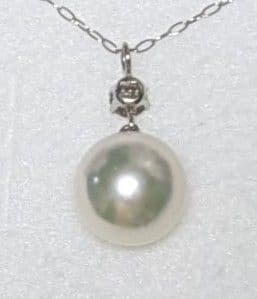 Akoya pearl and diamond pendant necklace featuring 8.3mm round white-green pearl with platinum chain