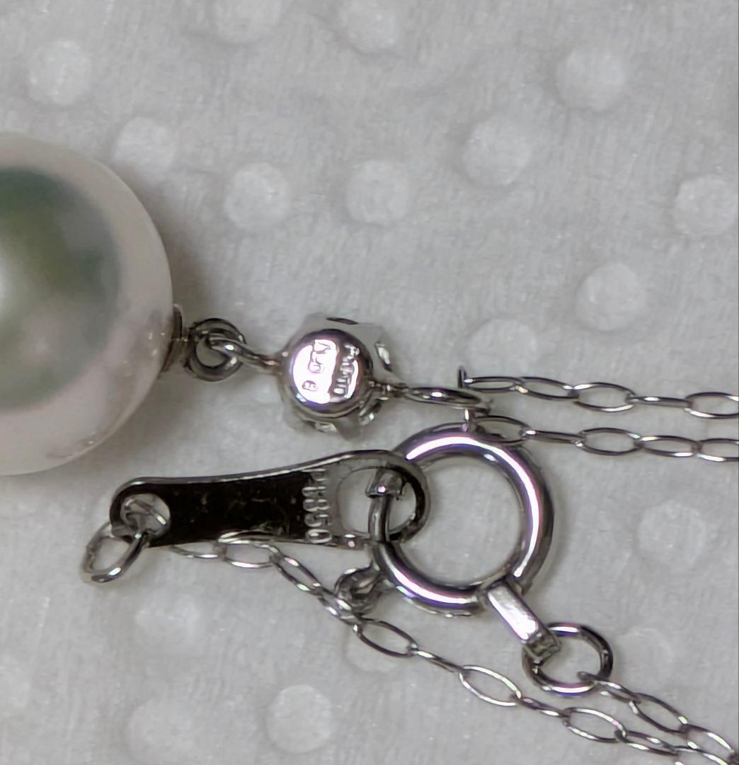 Akoya pearl and diamond pendant necklace featuring 8.3mm round white-green pearl with platinum chain