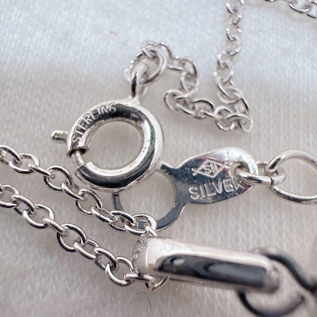Tasaki Pearl Basket Necklace with bell sound made of 925 silver, shown on white background