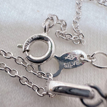 Tasaki Pearl Basket Necklace with bell sound made of 925 silver, shown on white background