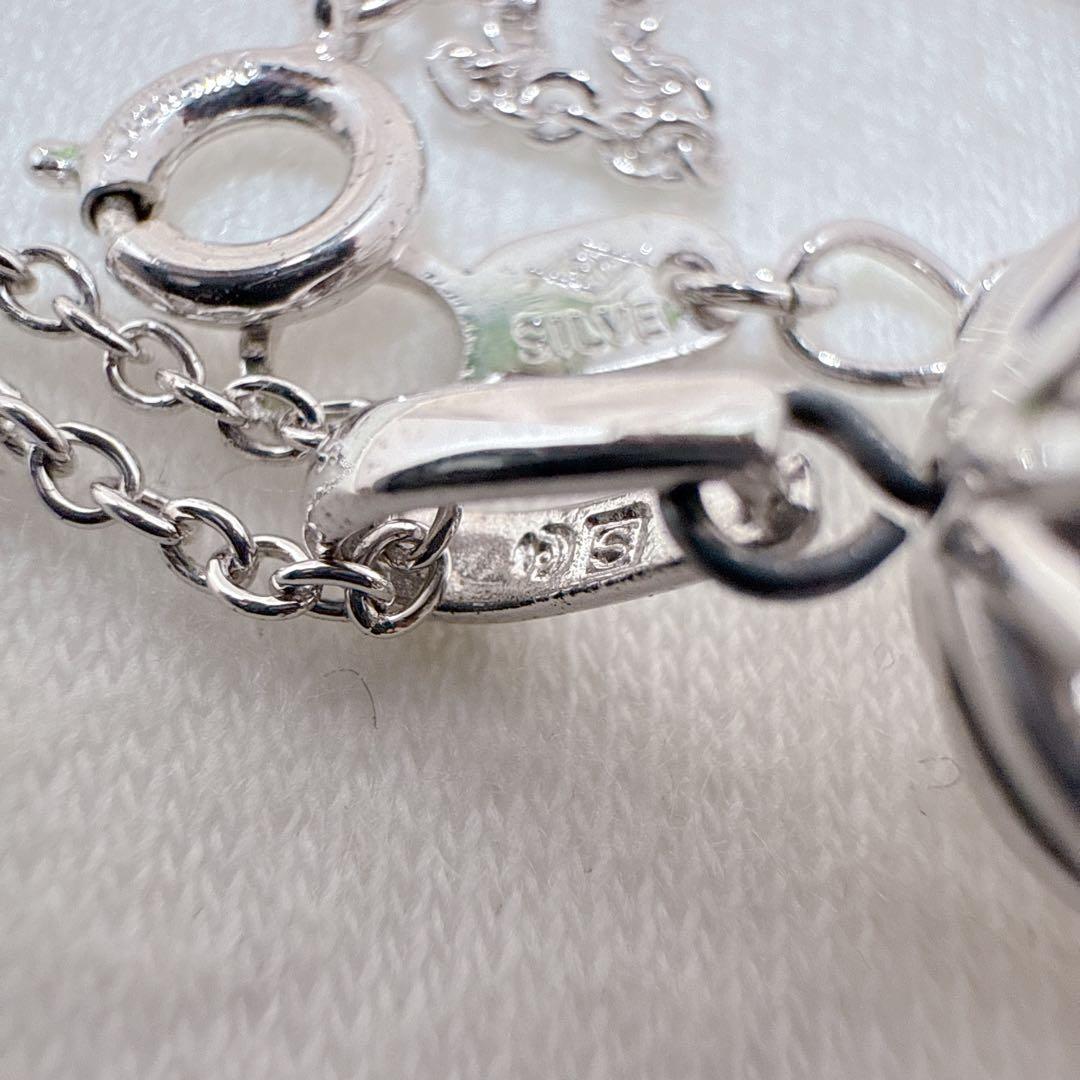 Tasaki Pearl Basket Necklace with bell sound made of 925 silver, shown on white background