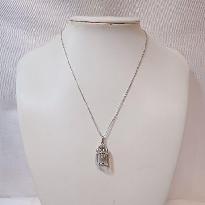 Tasaki Pearl Basket Necklace with bell sound made of 925 silver, shown on white background
